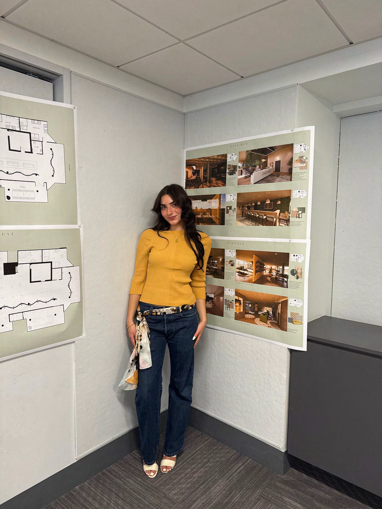 Maral Zobian standing in front of her ONESTOP thesis presentation boards